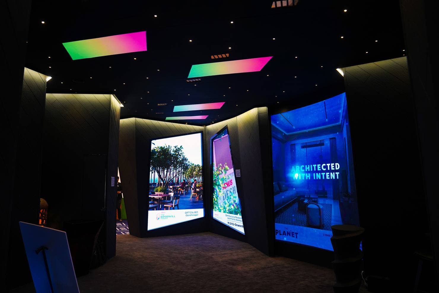 Close-up of LED tile joints, signal processors and speaker grilles integrated into an exhibition stall