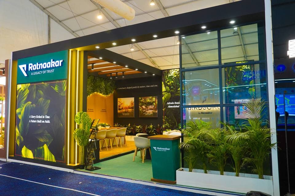 Exhibition booth interior with edge-lit acrylic brand wall