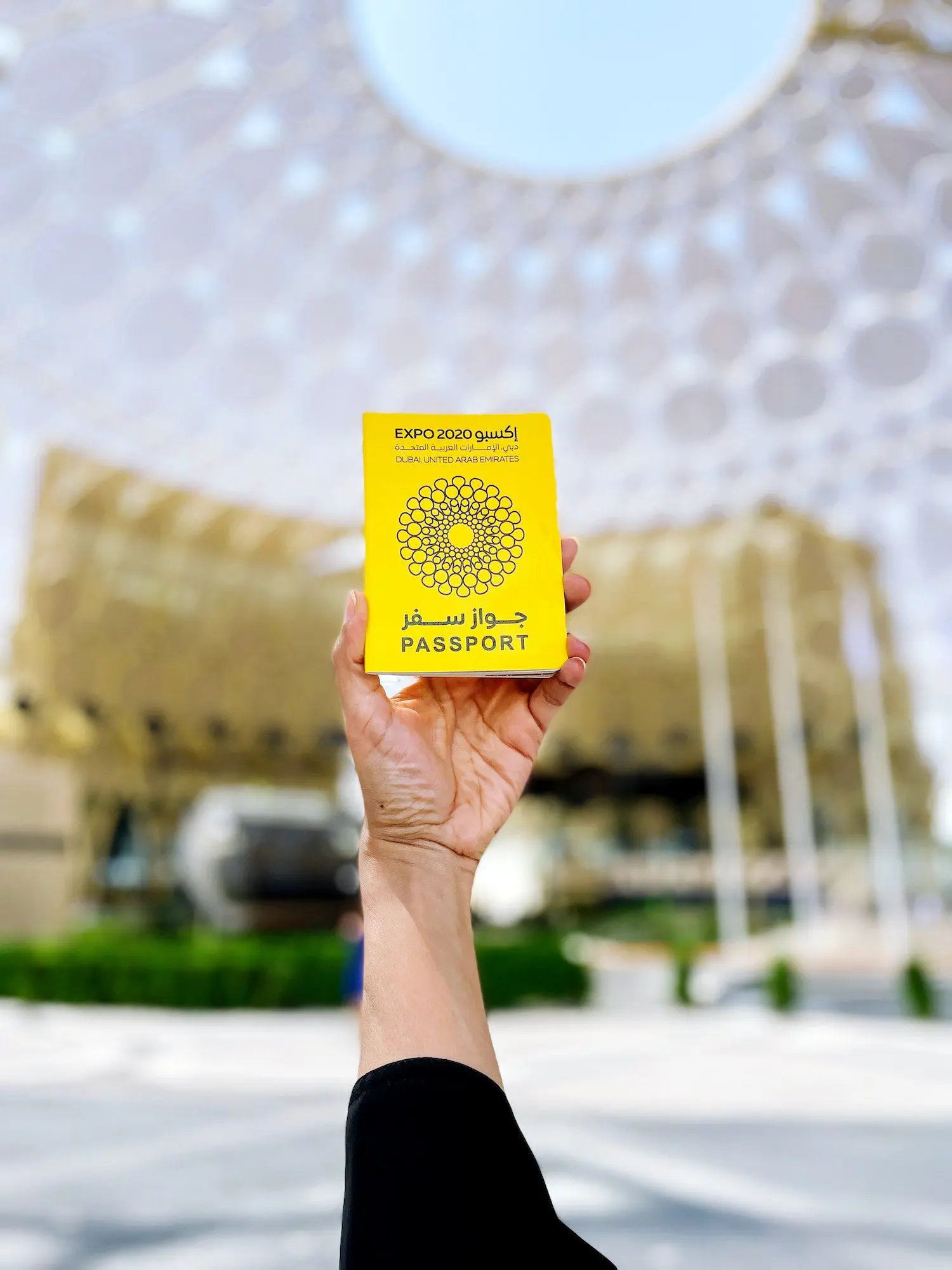 Hand holding Dubai expo 2020 passport