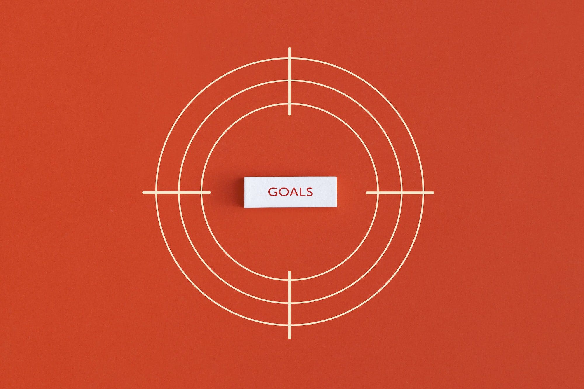 Goal word in the center of the target on red background.